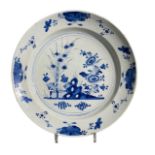 AN 18TH CENTURY DUTCH DELFTWARE BLUE AND WHITE PLATE Having central floral decoration encircled in
