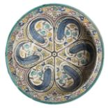 A LARGE HAND PAINTED CHARGER/BOWL Having a stylised geometric design front. (diameter 40cm)