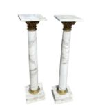 A FINE PAIR OF NEOCLASSICAL DESIGN WHITE MARBLE AND GILT BRONZE CORINTHIAN CAPITAL COLUMNS Raised on