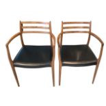 NIELS MOLLER, A PAIR OF DANISH OPEN ARMCHAIRS With leather seats, model 62, bearing label