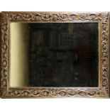 A LARGE DECORATIVE 18TH CENTURY SPANSIH COLONIAL DESIGN CARVED GILTWOOD MIRROR The rectangular frame