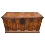 A 16TH/17TH CENTURY FRENCH GOTHIC WALNUT COFFER/CHEST The hinge lid above four arch linenfold panels