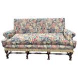 A WILLIAM AND MARY DESIGN FLORAL TAPESTRY UPHOLSTERED SETTEE The straight back above scrolling