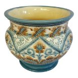 BURMANTOFTS, A LATE 19TH CENTURY FAIENCE POTTERY JARDINIÈRE Having incised scrolled decoration