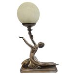 AN ART DECO DESIGN FIGURAL TABLE LAMP Metallic finish, seminude female dancer holding aloft a