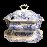 AN EARLY 19th CENTURY STAFFORDSHIRE BLUE AND WHITE POTTERY TUREEN AND STAND,twin handles,