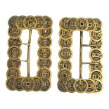 A PAIR OF VINTAGE CHINESE GILT METAL COIN BUCKLES Constructed with pierced chinese coins, with