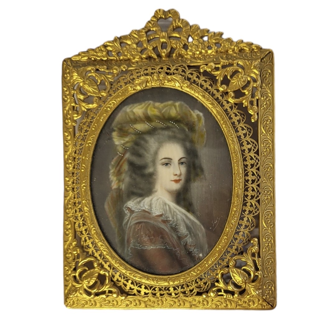 A 19TH CENTURY CIRCULAR MINIATURE PAINTING ON IVORY, PORTRAIT OF A LADY Signed with initials ‘