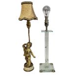 A VINTAGE BRASS AND ONYX FIGURAL LAMP Winged cherub with one arm raised with fabric shade, on a