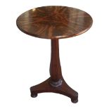 A WILLIAM IV PERIOD MAHOGANY OCCASIONAL TABLE With flame circular top raised on a faceted column