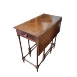 AN EDWARDIAN MAHOGANY DROP LEAF OCCASIONAL TABLE With single drawer, turned legs along with a