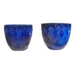 A PAIR OF BLUE GLAZED STONEWARE GOTHIC GARDEN PLANTERS. Condition: good