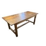 A COUNTRY PINE REFECTORY TABLE With plank top on square chamfered. (185cm x 84cm x 76cm)