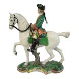 A NYMPHENBURG LATE 19TH/EARLY 20TH CENTURY HARD PASTE PORCELAIN FIGURAL GROUP, PRUSSIAN HUNTER ON