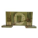 A MID CENTURY GREEN ONYX RECTANGULAR MANTLE CLOCK With gilt brass mounts, circular dial with
