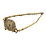 BUREN, AN ART DECO 9CT GOLD LADIES’ WRISTWATCH Lozenge form dial with Arabic number markings, on