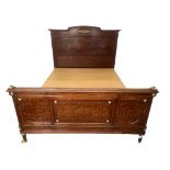 AN EARLY 20TH FRENCH MAHOGANY PARQUETRY AND GILT METAL MOUNTED DOUBLE BEDSTEAD, With side rails.