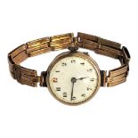 AN EARLY 20TH CENTURY 9CT GOLD LADIES’ WRISTWATCH Circular white dial with red number twelve, on