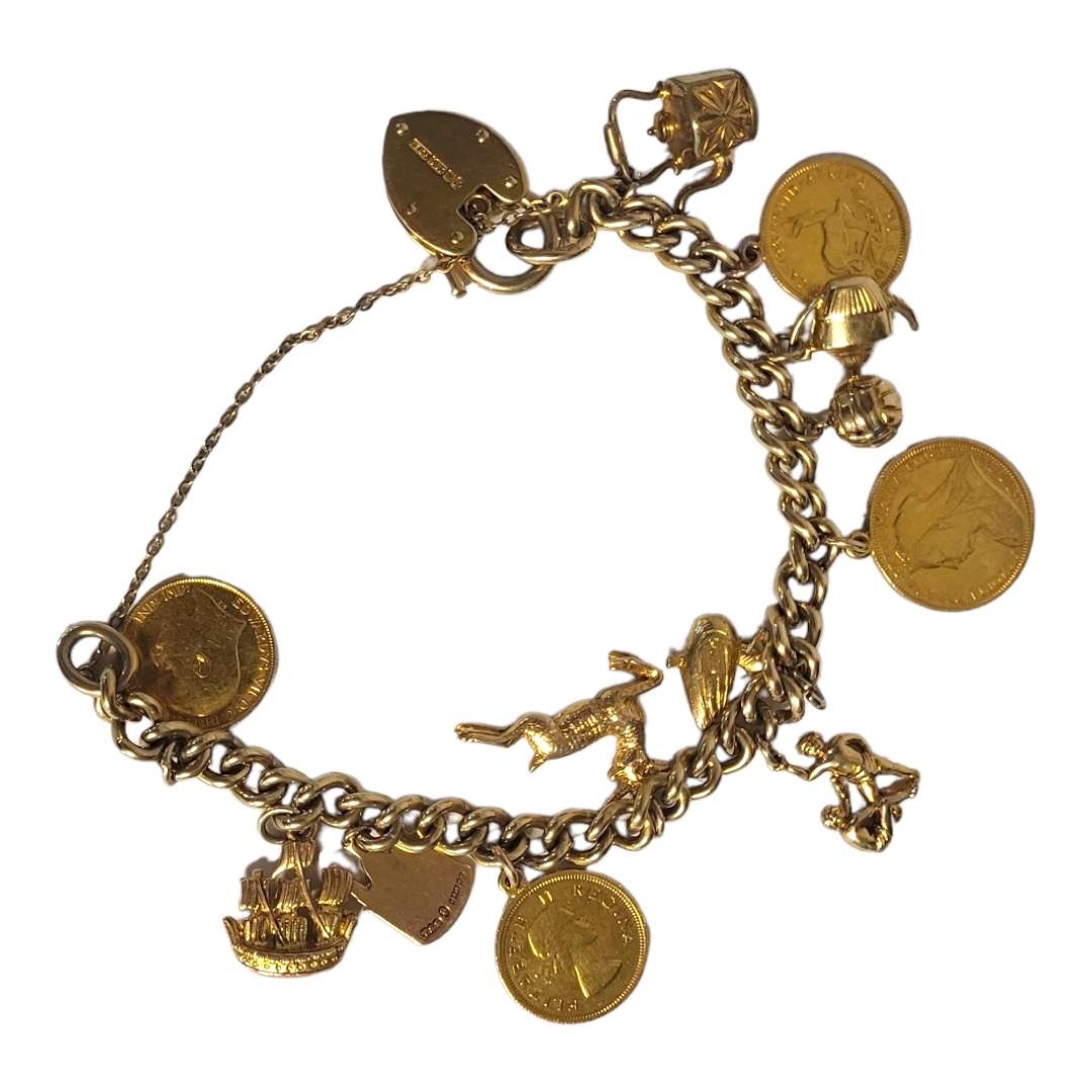 A VINTAGE 9ct GOLD AND GOLD COIN SET CHARM BRACELET set with a Victorian 22ct Gold full sovereign