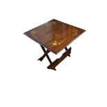 A 20TH CENTURY INDIAN ROSEWOOD BRASS INLAID COACHING/FOLDING TABLE Inlaid in flora design brass