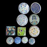 FOUR MODERN TURKISH POTTERY CHARGERS hand painted with iznik style decoration, four small plates,