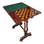 A VICTORIAN MAHOGANY FOLD OVER GAMES TABLE Having an inlaid chess board and green baize lined
