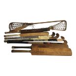 A COLLECTION OF VINTAGE CRICKET BATS AND HOCKEY STICKS AND LACROSSE four bats bearing makers