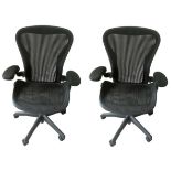 A PAIR OF HERMAN MILLER OFFICE CHAIRS, two dot, In charcoal fabric upholstery registration marks