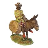 A RARE BESWICK POTTERY FIGURAL GROUP, A YOUNG JAMAICAN GIRL SITTING ON A DONKEY Titled ‘Susie