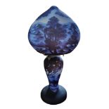 A GALLE STYLE GLASS TABLE LAMP with landscape shade and base on a blue ground Condition good