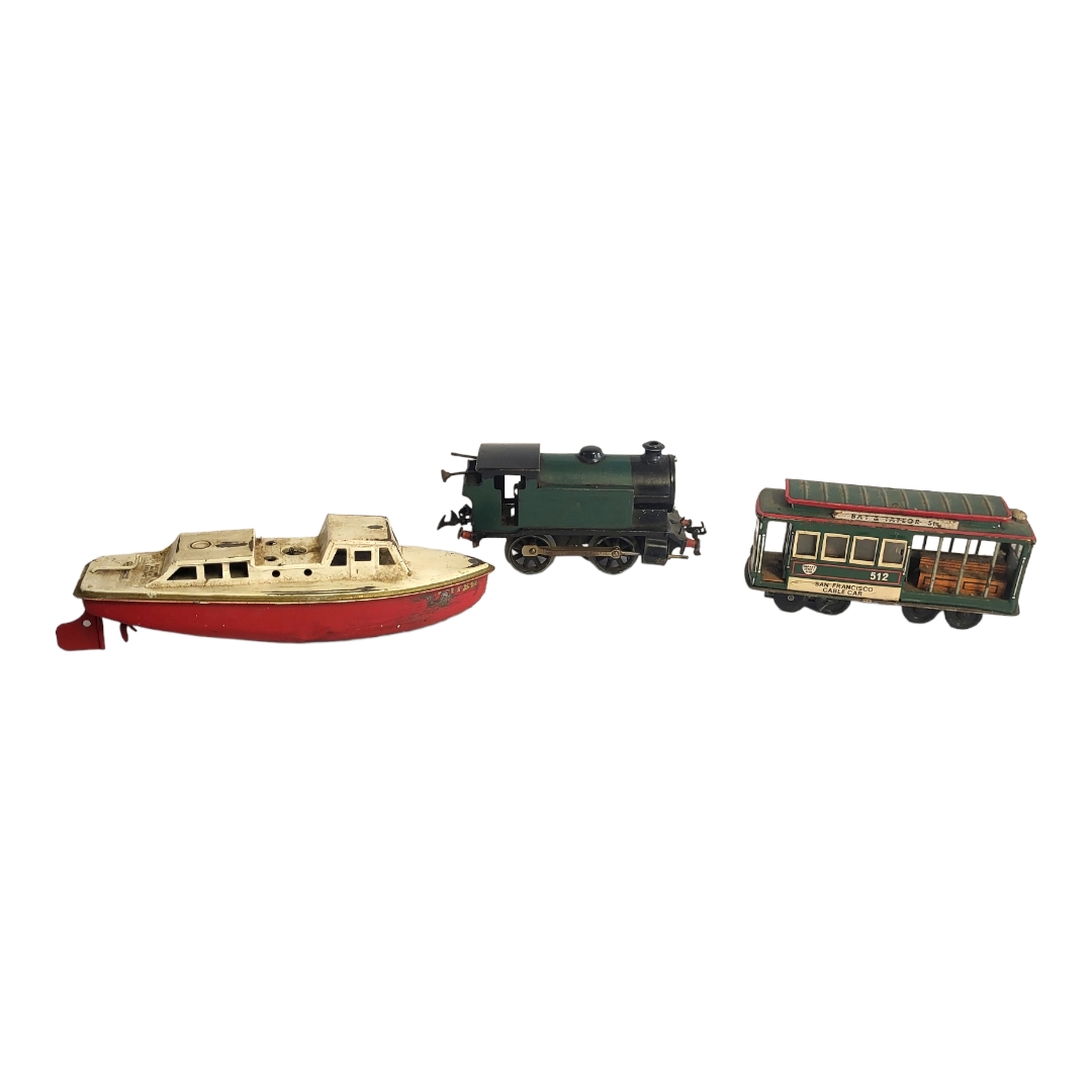 AN EARLY 20TH CENTURY DIECAST AND TINPLATE MODEL OF A STEAM LOCOMOTIVE ON FOUR WHEELS Unmarked, a