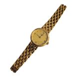 LONGINES, AN 18CT GOLD LADIES’ WRISTWATCH Gold tone circular dial with integral 18ct gold bracelet