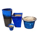 A COLLECTION OF FOUR BLUE GLAZED STONEWARE GARDEN PLANTERS Various sizes. Condition: one has