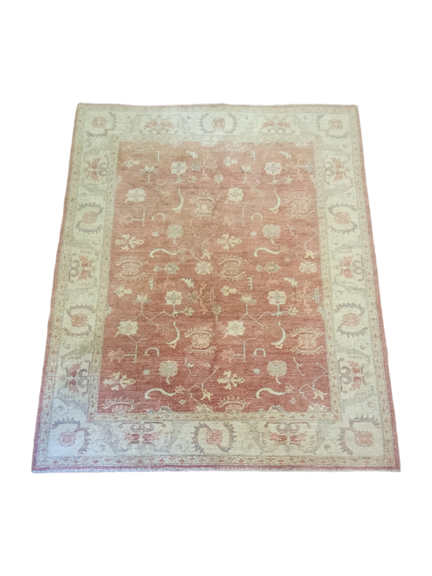 A PERSIAN WOOLLEN RUG, hand woven with floral decoartion on amber central field on oatmeal cream