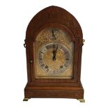 WINTERHALDER AND HOFMEIER, A 19TH CENTURY GERMAN MAHOGANY AND BRASS MANTLE CLOCK Having an arch form