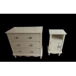 A MODERN CREAM FINISH THREE DRAWER CHEST OF DRAWERS along with bedside cupboard, heart shaped