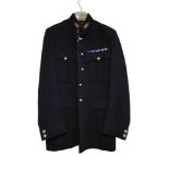 A BRITISH ROYAL ARTILLERY NUMBER 1 JACKET Black jacket with collar badges and metal buttons, the