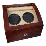 HILLWOOD OF LONDON, A GLAZED WALNUT WATCH WINDER The fitted soft leather interior having two winding