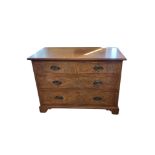 AN EARLY 20TH CENTURY GEORGIAN DESIGN POLLARD OAK CHEST with two short above two long drawers, brass