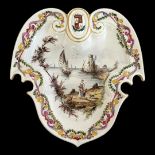 A FRENCH LILLE FACTORY EARLY 20TH CENTURY 18TH CENTURY STYLE CARTOUCHE SHAPE FAIENCE ARMORIAL DISH