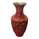 AN EARLY 20TH CENTURY CHINESE RED CINNABAR LACQUERED ‘FLORA’ VASE, CIRCA 1900 - 1910 A baluster form