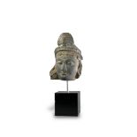 A Grey Schist Bodhisattva Head, Gandhara, 3rd/4th century AD, the deity with finely delineated