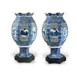 A fine Pair of blue and white openwork Lanterns, c.1900, of hexagonal section, the upper part with