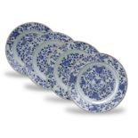 A Set of Four Blue and White Plates, Kangxi the centre and the everted rim decorated with bands of