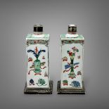 A Pair of Square 'famille verte' Bottles, Kangxi, decorated with alternating panels of antiques