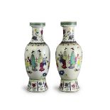 A pair of 'famille rose' Vases, Republic period, each of tall ovoid form with flared foot, with a