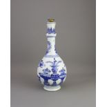 A blue and white â€˜hundred antiquesâ€™ bottle vase, Kangxi well-potted bottle vase with underglazes