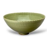 A carved celadon bowl with petalled mouth, carved with peony both inside and outside,W: 28cm ,