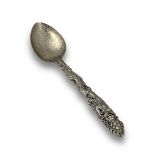 A Tibetan Silver Spoon, 18th/19th century, the stem finely cast and chased with a fierce dragon in