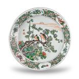 An Attractive'famille verte' Birds and Flowers Dish, Kangxi, of large saucer form, well painted in